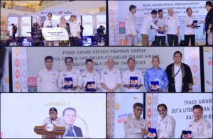 Pj. Bupati Bombana Raih DILAN Award 2024, Dorong Inklusi Keuangan dan Kesejahteraan Masyarakat